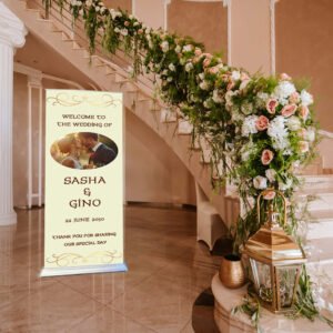 Retractable banner stands displaying wedding couple photo at reception